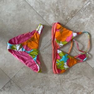 Trina Turk size 2 reversible bikini. Super cute tassels with gold accents.